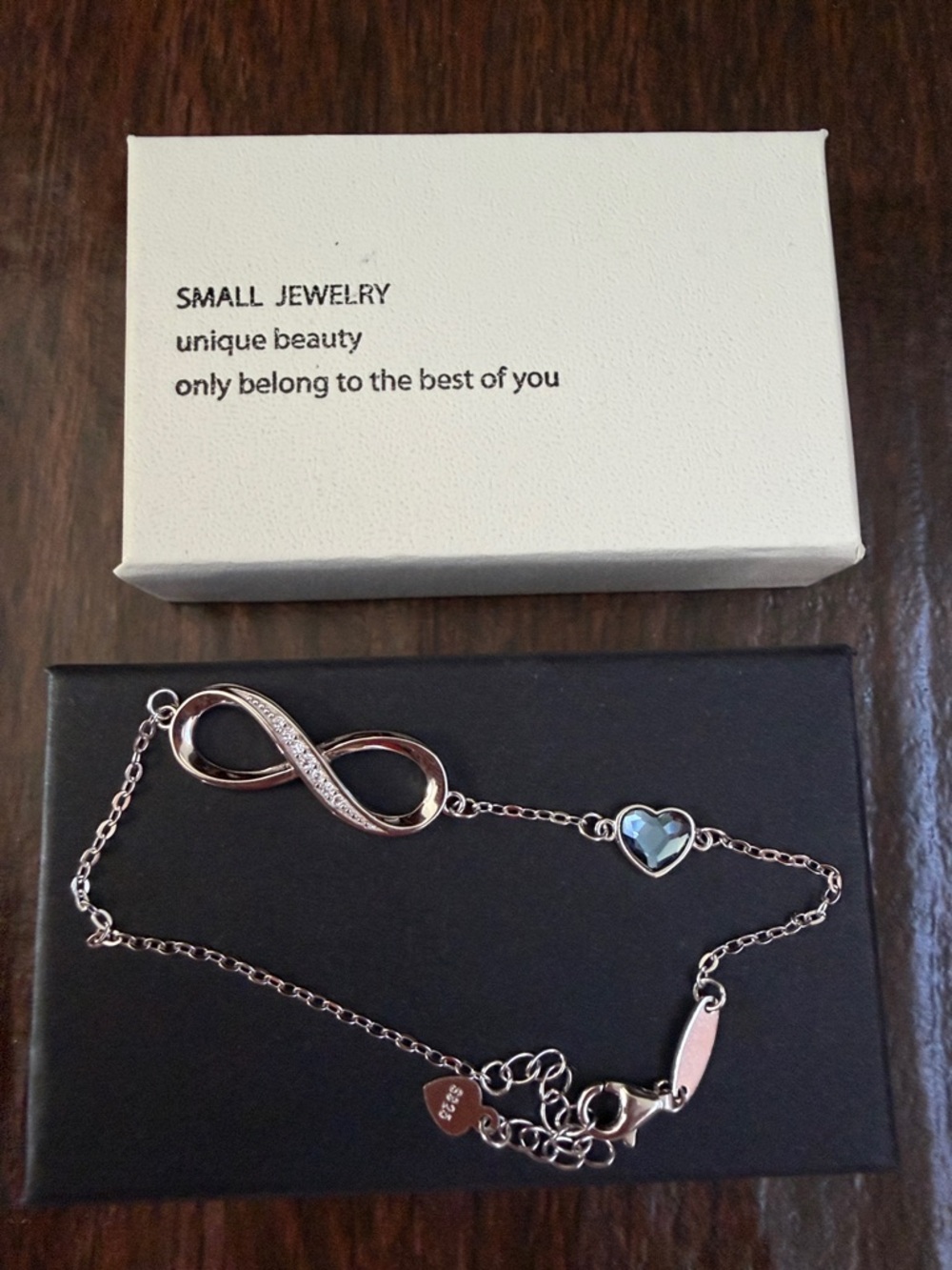 Silver Infinity Bracelet with Blue Heart Accent